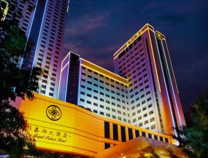 a large building with a sign in front of it at Regal Palace Hotel in Dongguan