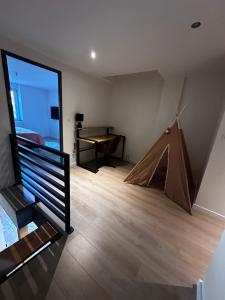 a room with a tent and a table in it at Charmante Maison in Abrest