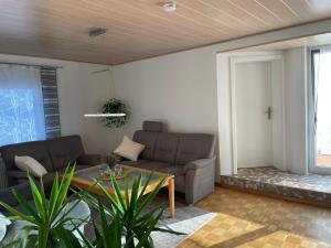 a living room with a couch and a table at Apartment Salvete in Sulzbach-Rosenberg