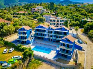 an aerial view of a house with a swimming pool at Blue dream in Nikiana