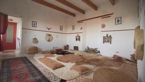 a large bedroom with a large bed in a room at Nuragic Temple in Esterzili