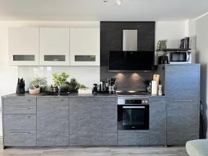 Η κουζίνα ή μικρή κουζίνα στο Schönes PENTHOUSE Dümmer See - Lembruch