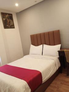 Katil atau katil-katil dalam bilik di Hotel Astoria Tanger