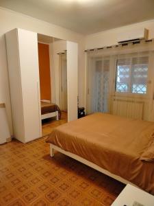 Ένα ή περισσότερα κρεβάτια σε δωμάτιο στο Casa Francesca