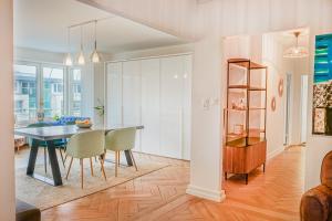 a kitchen and dining room with a table and chairs at Downtown Zurich - Large, quiet private room "Alps" in homestay - Enge station - Lake & City - For 1 person in Zurich