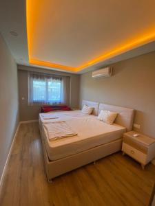 Ένα ή περισσότερα κρεβάτια σε δωμάτιο στο Mali Garden Residence