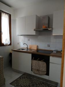 a kitchen with a sink and a counter top at Casa Dolce Paola in Cagliari