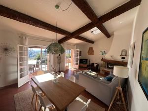 a living room with a table and a couch at Villa Vence in Vence
