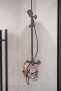 a microphone hanging on a wall in a room at Perfect for Contractors & Families - Free Parking in Banbury