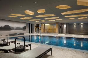 a large swimming pool in a hotel room at Four Seasons Hotel Seoul in Seoul