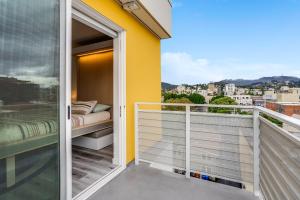 a balcony with a bed and a view of the city at View of Hollywood Sign Studio, Free Parking in Los Angeles