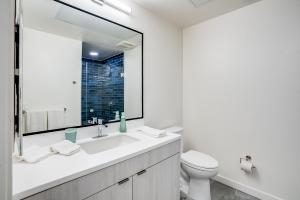 a bathroom with a sink and a toilet and a mirror at View of Hollywood Sign Studio, Free Parking in Los Angeles +11 photos