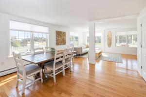 a dining room and living room with a table and chairs at 3BR Beach House, Walk to Sand & Sea in Scarborough