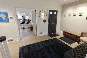 a living room with a black door and a couch at Idyllic Georgetown in Washington