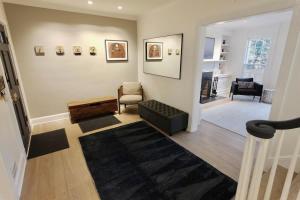 a living room with a couch and a chair at Idyllic Georgetown in Washington +38 photos