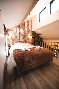 Voodi või voodid majutusasutuse Cosy Wood toas