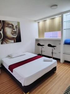 Postel nebo postele na pokoji v ubytování Hotel Yellow Maraya, Pereira