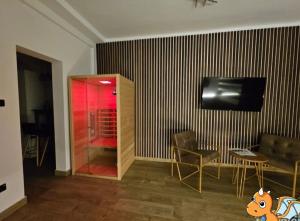 TV a/nebo společenská místnost v ubytování Dragon Nest SPA Concept