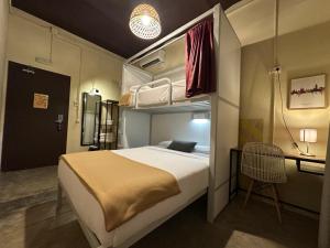 Cama ou camas em um quarto em The Loft House Barcelona