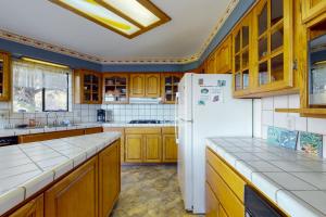 Kuchyň nebo kuchyňský kout v ubytování Whale Song + 18 fotografií