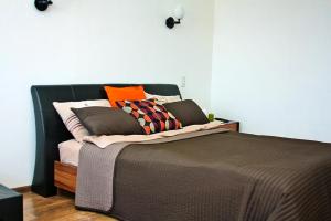 Alliance Apartments at Osrovskogoにあるベッド