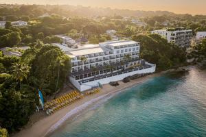 an aerial view of a hotel on the beach at Waves Resort & Spa, Barbados, An Autograph Collection All-Inclusive Resort in Saint James +99 photos