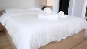 Postel nebo postele na pokoji v ubytování Rodax Residence