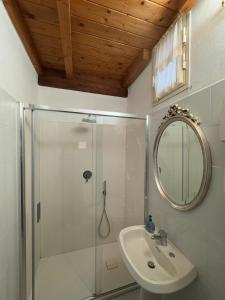 a bathroom with a shower and a sink and a mirror at Scrigno di Buranco in Monterosso al Mare +51 photos