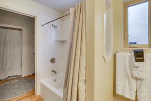 a bathroom with a shower and a tub and a sink at Ski, Kayak, Fish Ogden RioVista with Patio in Ogden +21 photos