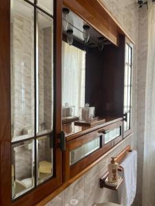 a bathroom with a sink and a mirror at Casa MaRo' in Capaci