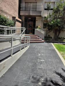 a walkway in front of a building with stairs at Aires del Parque in Paraná