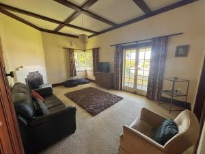 Postel nebo postele na pokoji v ubytování Kowhai Cottage