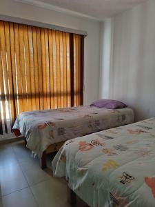 Postel nebo postele na pokoji v ubytování Casa Mision Comoda casa en fraccionamiento con alberca Facturamos