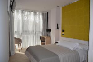 Łóżko lub łóżka w pokoju w obiekcie Hotel Bilbao Plaza