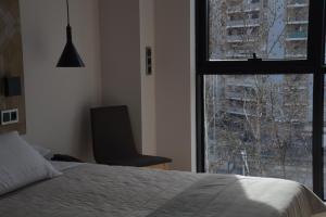 Łóżko lub łóżka w pokoju w obiekcie Hotel Bilbao Plaza