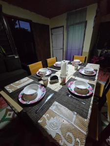 a table with plates and dishes on top of it at Mumma Loii's Fijian Village Homestay in Malevu +10 photos