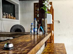 a counter with two bottles of water on it at Pousada Abacateiro in Búzios +30 photos