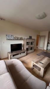 a living room with a couch and a coffee table at City kvart 2 bedroom apartment in Podgorica