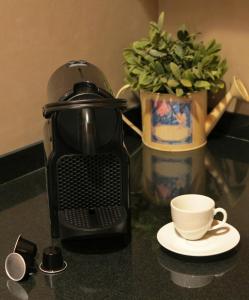 Coffee and tea making facilities at Apartment Sant Francesc