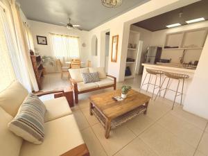 a living room with a couch and a table at Estudio con Terraza in Todos Santos