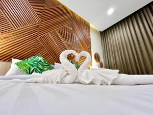Postel nebo postele na pokoji v ubytování Asawann Hotel Suvarnabhumi