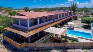 an aerial view of a house with a swimming pool at Villa Mar - Baia Formosa in Baía Formosa
