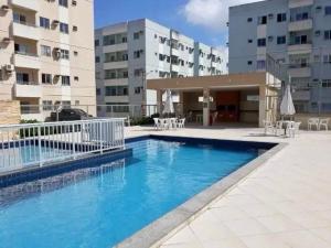 a large swimming pool in front of a building at Aconchego no Solar do Coqueiro in Ananindeua