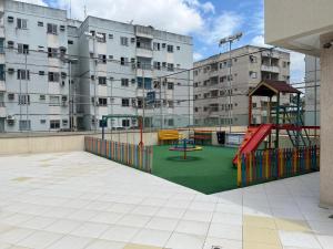 a playground on the roof of an apartment building at Aconchego no Solar do Coqueiro in Ananindeua