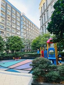 a playground in front of a large building at We Vibe, 81 Newport Blvd across NAIA 3 in Manila +64 photos