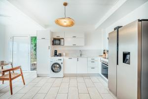 Cucina o angolo cottura di Appartement T3 -Villa Les Bougainvilliers