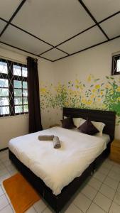 Ένα ή περισσότερα κρεβάτια σε δωμάτιο στο Natol Homestay - Venice Samajaya Tabuan Tranquility Township