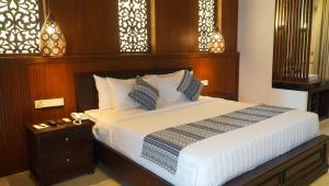 Postel nebo postele na pokoji v ubytování Bali Tropic Resort & Spa - CHSE Certified