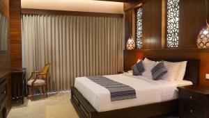 Postel nebo postele na pokoji v ubytování Bali Tropic Resort & Spa - CHSE Certified
