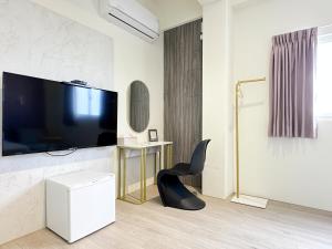 Een TV en/of entertainmentcenter bij 沙沙民宿
